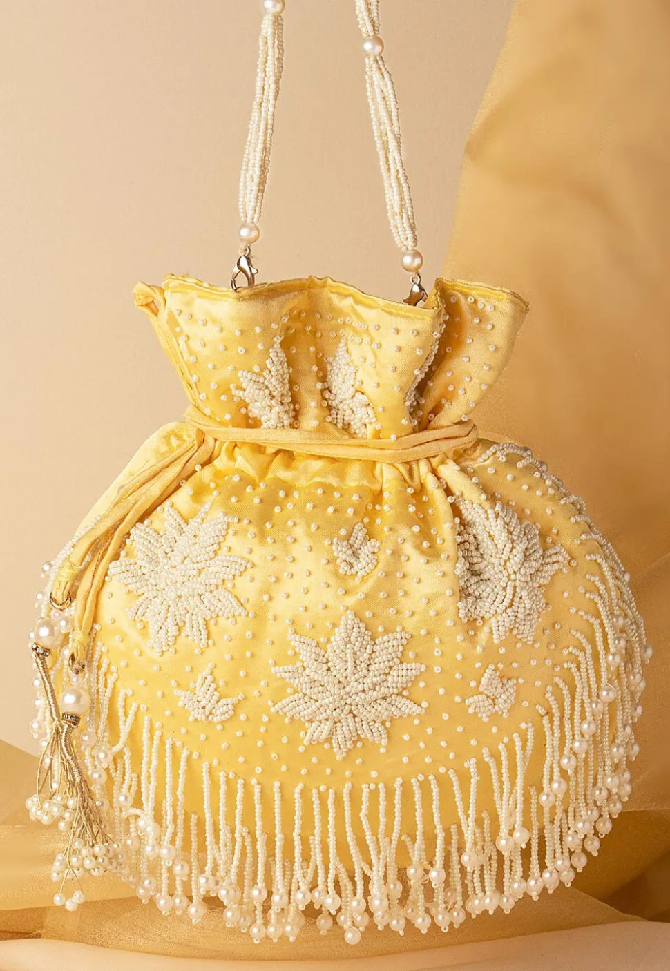 Hand Embroidered Art Silk Potli Bag in Pastel Yellow