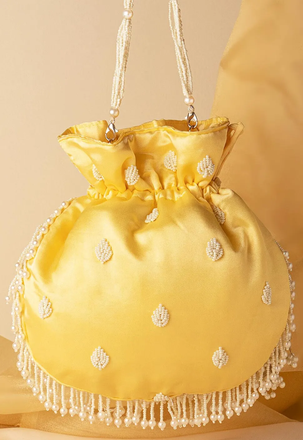 Hand Embroidered Art Silk Potli Bag in Pastel Yellow