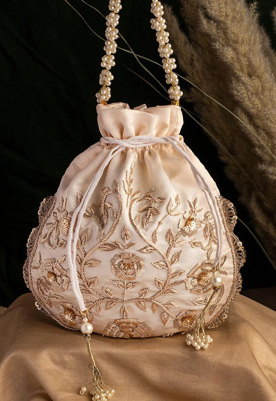 Hand Embroidered Art Silk Potli Bag in Off White