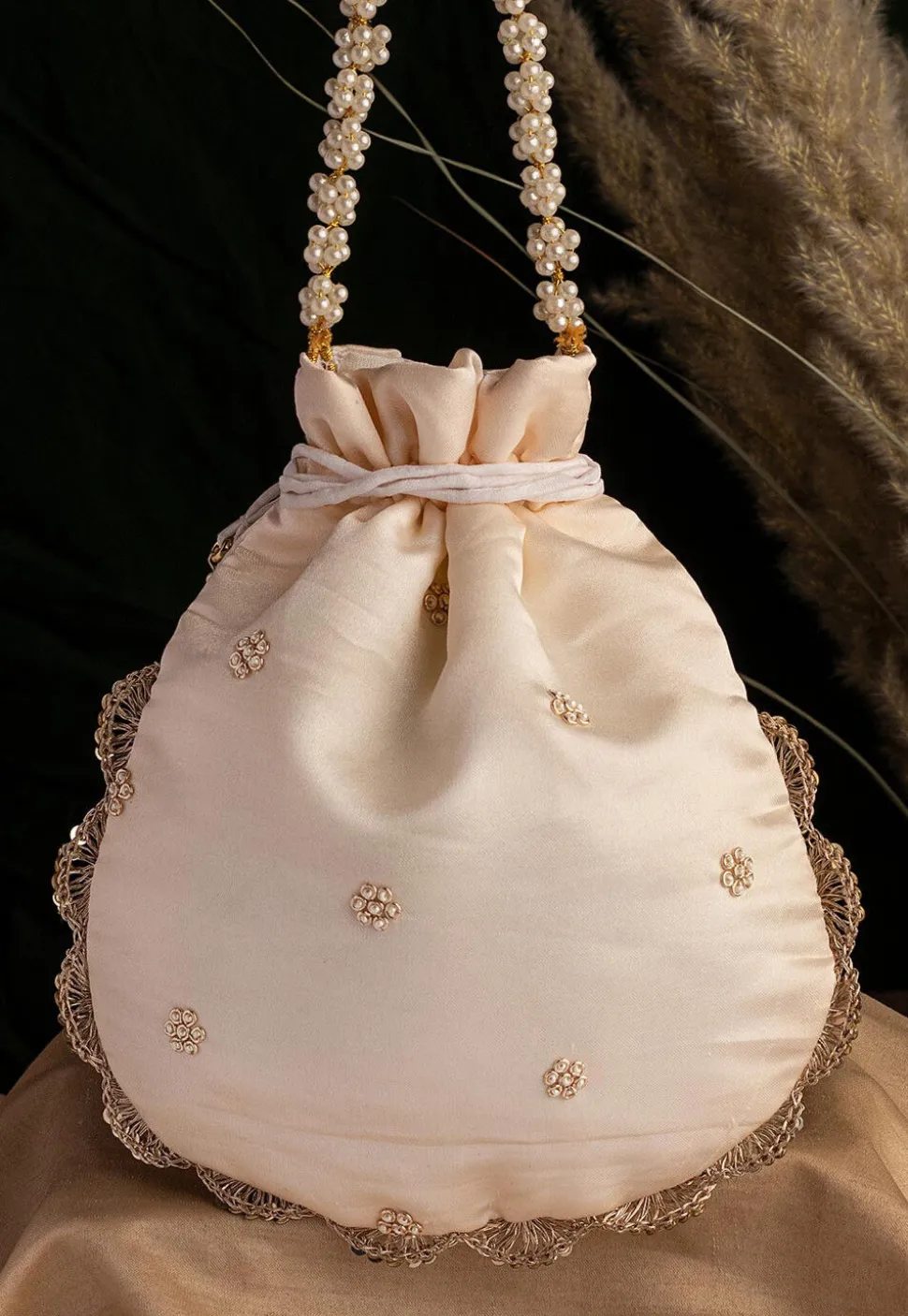 Hand Embroidered Art Silk Potli Bag in Off White