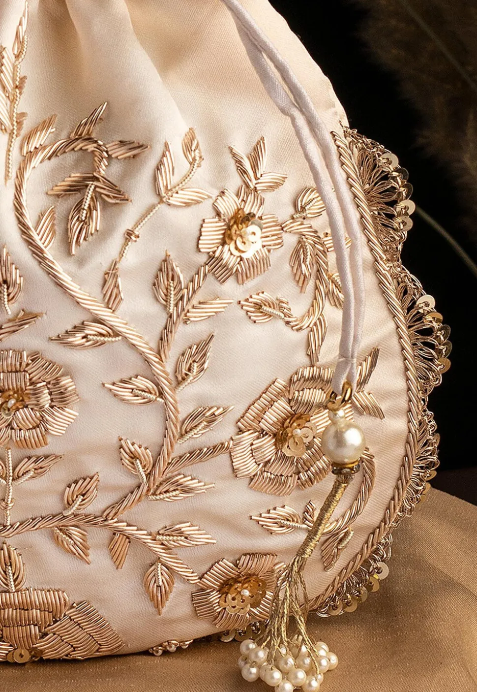 Hand Embroidered Art Silk Potli Bag in Off White