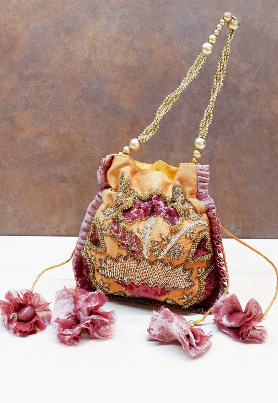 Hand Embroidered Art Silk Potli Bag in Dark Mustard