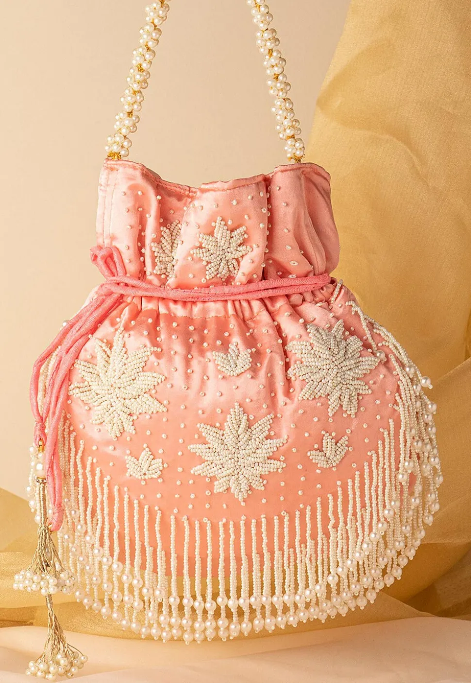 Hand Embroidered Art Silk Potli Bag in Peach