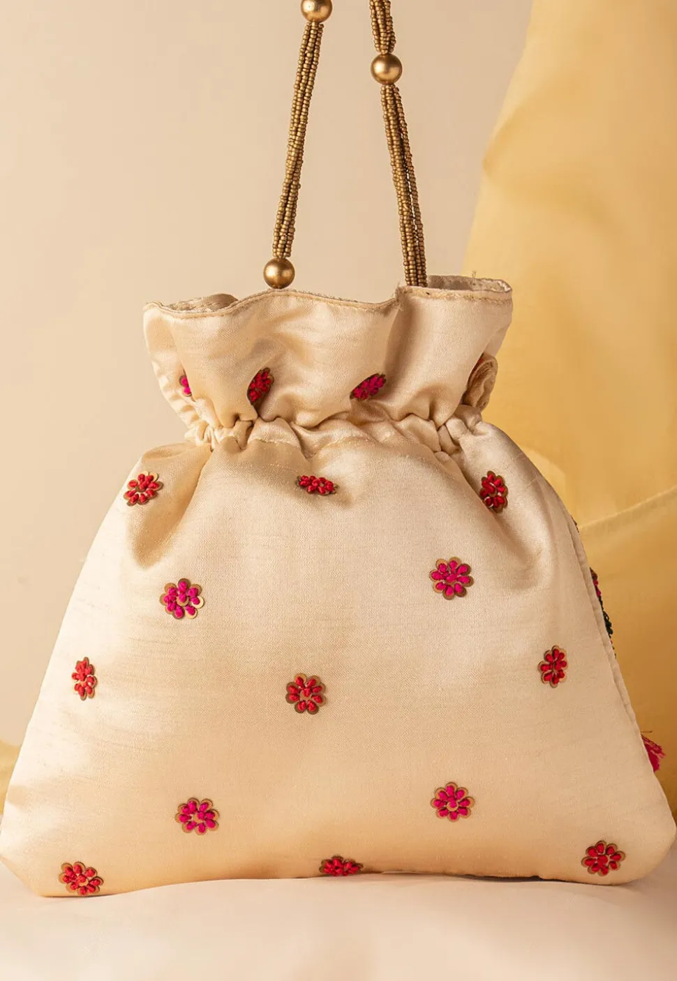 Hand Embroidered Art Silk Potli Bag in Beige