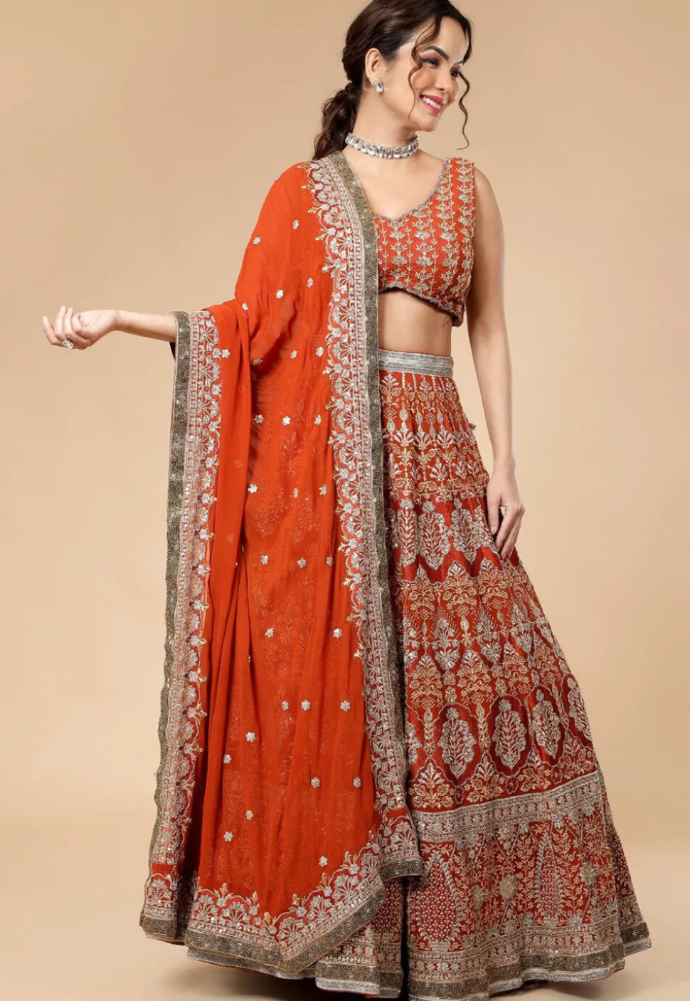 Hand Embroidered Viscose Georgette Lehenga in Rust