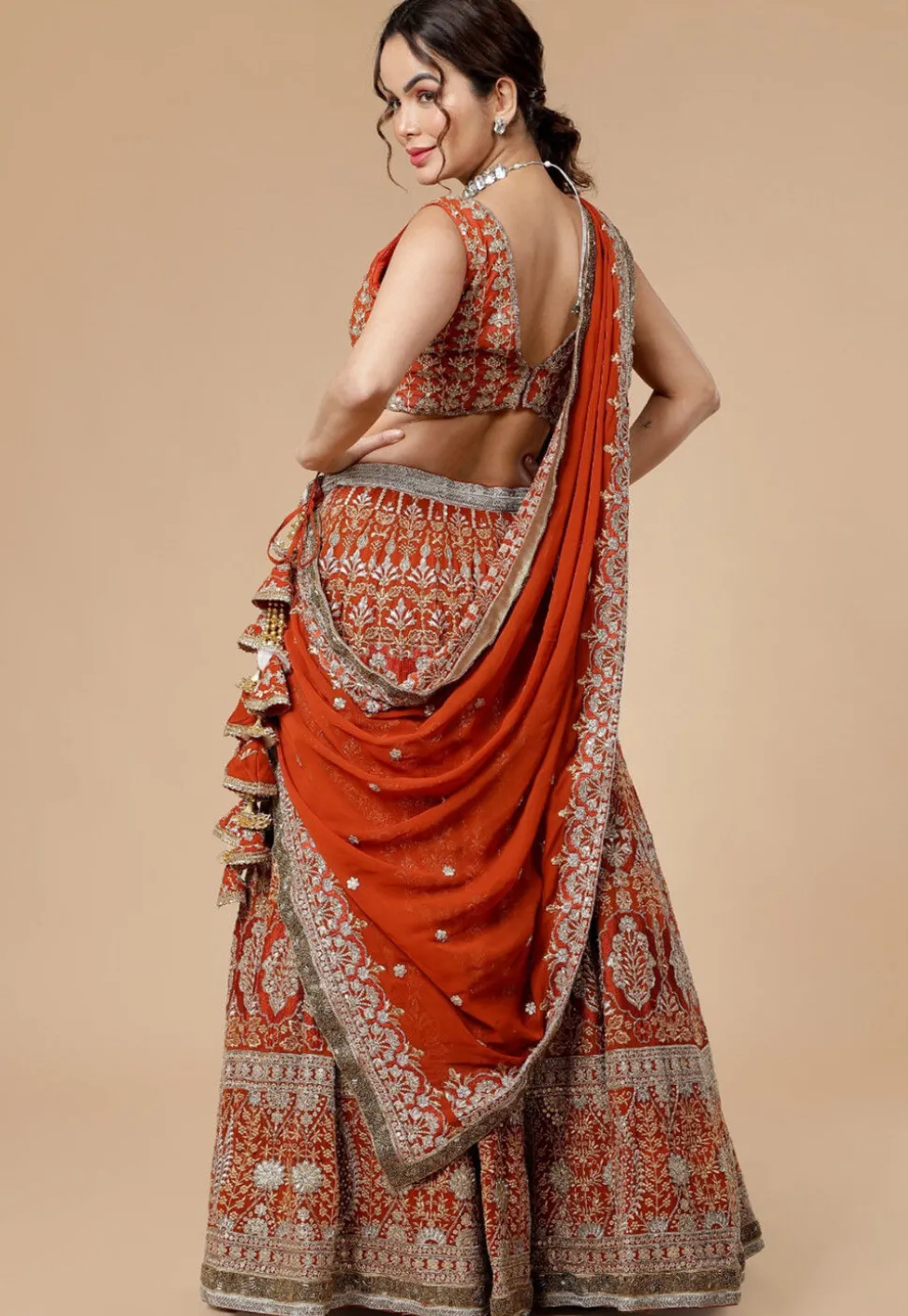 Hand Embroidered Viscose Georgette Lehenga in Rust