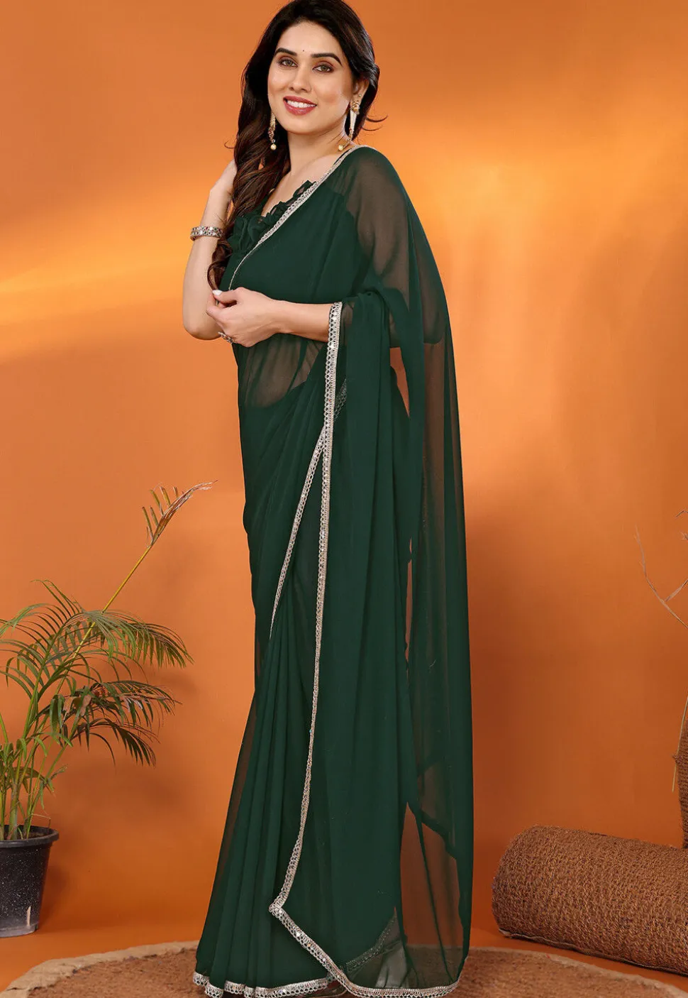 Lace Embellished Georgette Saree in Dark Green