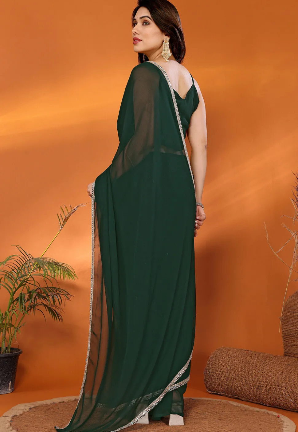 Lace Embellished Georgette Saree in Dark Green