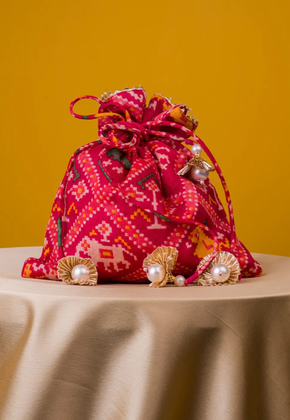 Patola Printed Kota Silk Potli Bag in Fuchsia