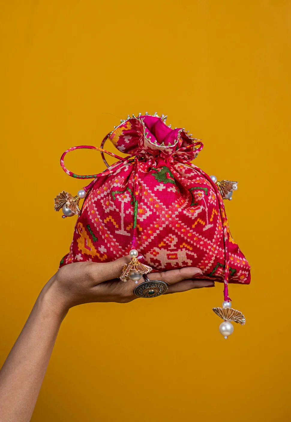 Patola Printed Kota Silk Potli Bag in Fuchsia